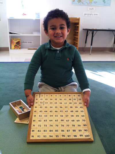 Boy working with numbers at Westwood Montessori